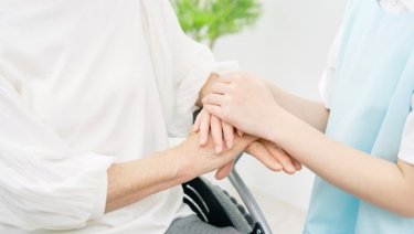 Close-up of two hands overlapping, one on top of the other
